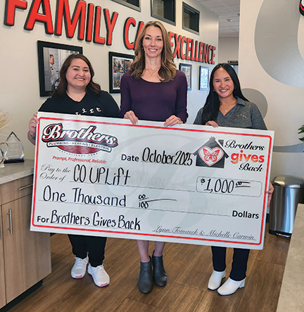 Lynn presenting a $1000 check to Colorado UpLift for Brothers Gives Back